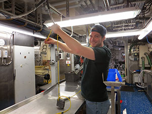 Andrew holds up one of the temperature sensors that will be deployed with the ROV
