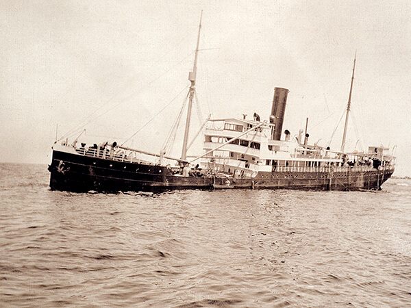 a Black and white photo of a ship